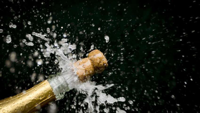 An image of a champagne cork popping out